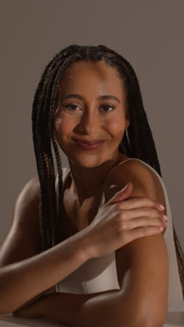 Studio-Portrait-Shot-Of-Young-Woman-Feeling-Softness-Of-Skin-After-Using-Beauty-Product-2